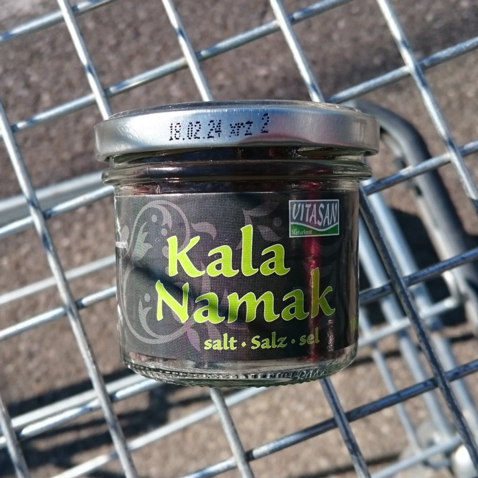 A small glass of kala namak salt.