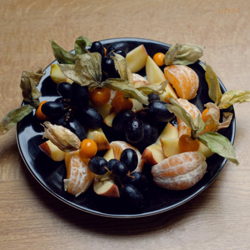 A plate with various fruits.