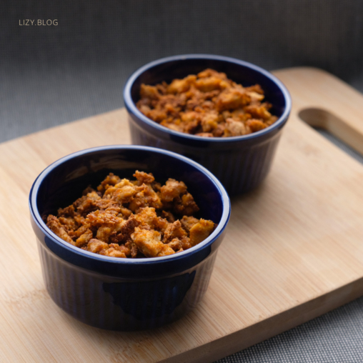 Two bowls with tofu crumbles.